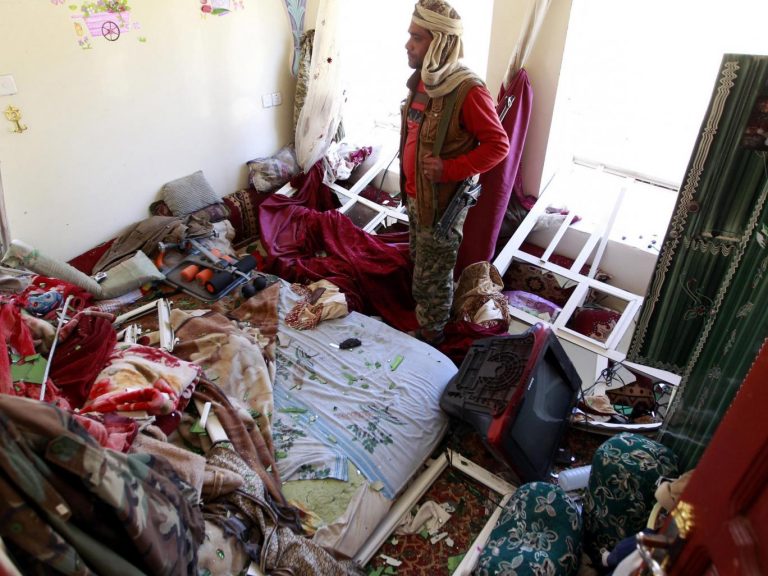 A Yemeni man inspects the damage in his house following air strikes carried out by the Saudi-led coalition in the capital Sanaa. AFP